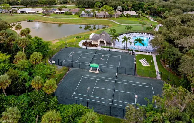 a swimming pool with outdoor seating and yard