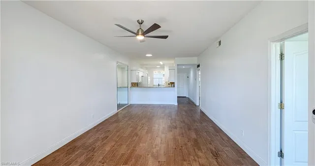a view of a livingroom with wooden floor