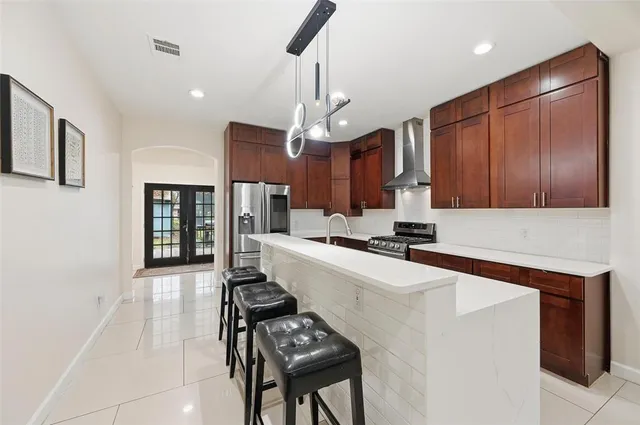 a kitchen with a sink appliances and cabinets