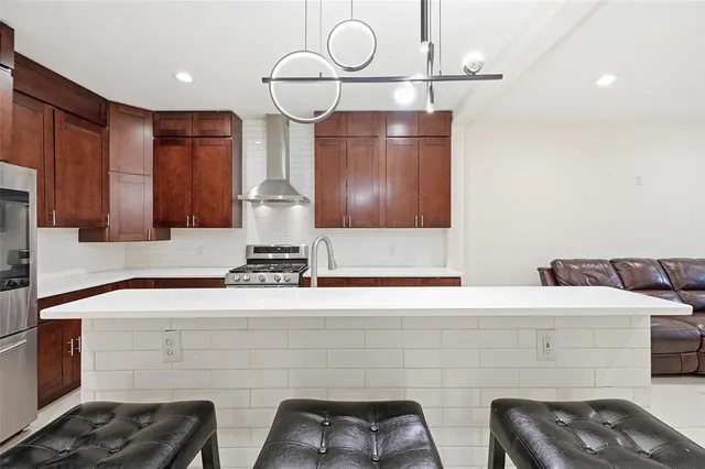 a bathroom with double vanity and a sink
