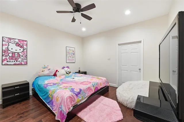 a bedroom with two beds and painted walls