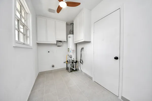 a view of empty room with a fireplace