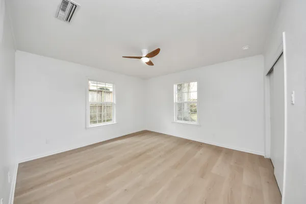 a view of an empty room with a window