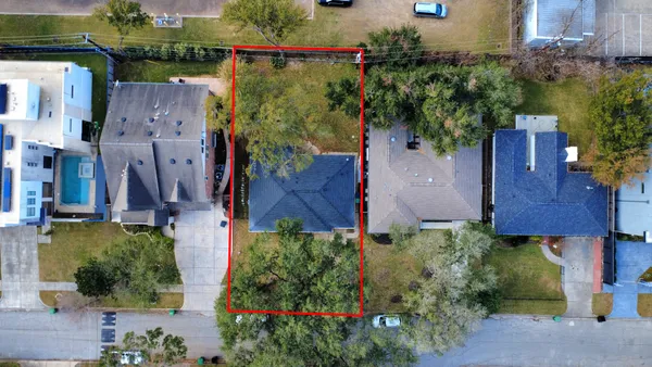 an aerial view of houses and roads