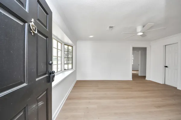a view of an empty room with a window