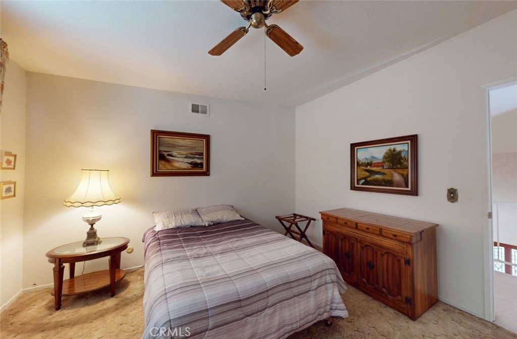 9901 Westhaven Circle Westminster, CA 92683 - Photo 21 of 41 a bedroom with a bed and a chandelier