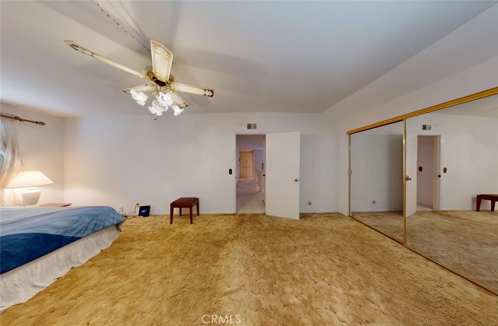 9901 Westhaven Circle Westminster, CA 92683 - Photo 22 of 41 a bedroom with a bed and a chandelier