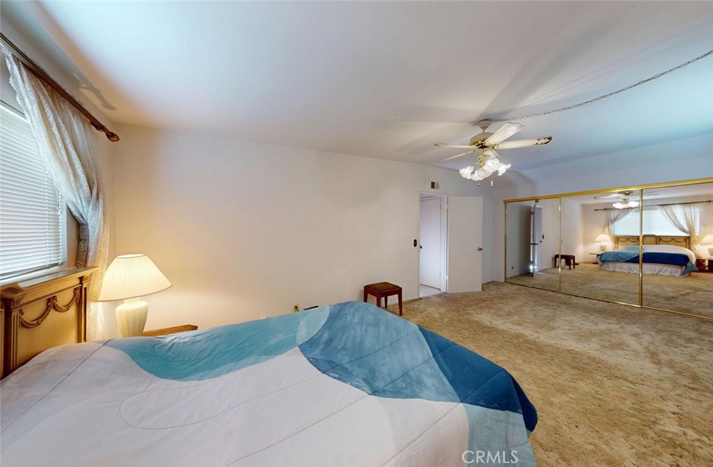 9901 Westhaven Circle Westminster, CA 92683 - Photo 23 of 41 a bedroom with a bed and lamp chandelier