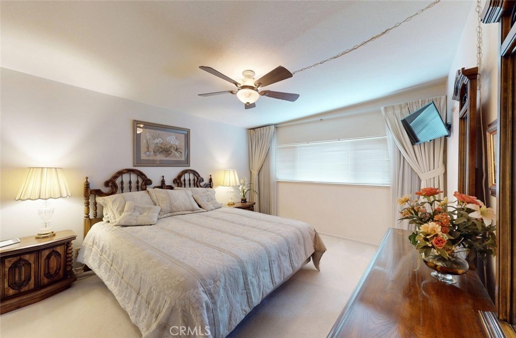 9901 Westhaven Circle Westminster, CA 92683 - Photo 26 of 41 a bedroom with bed and a chandelier