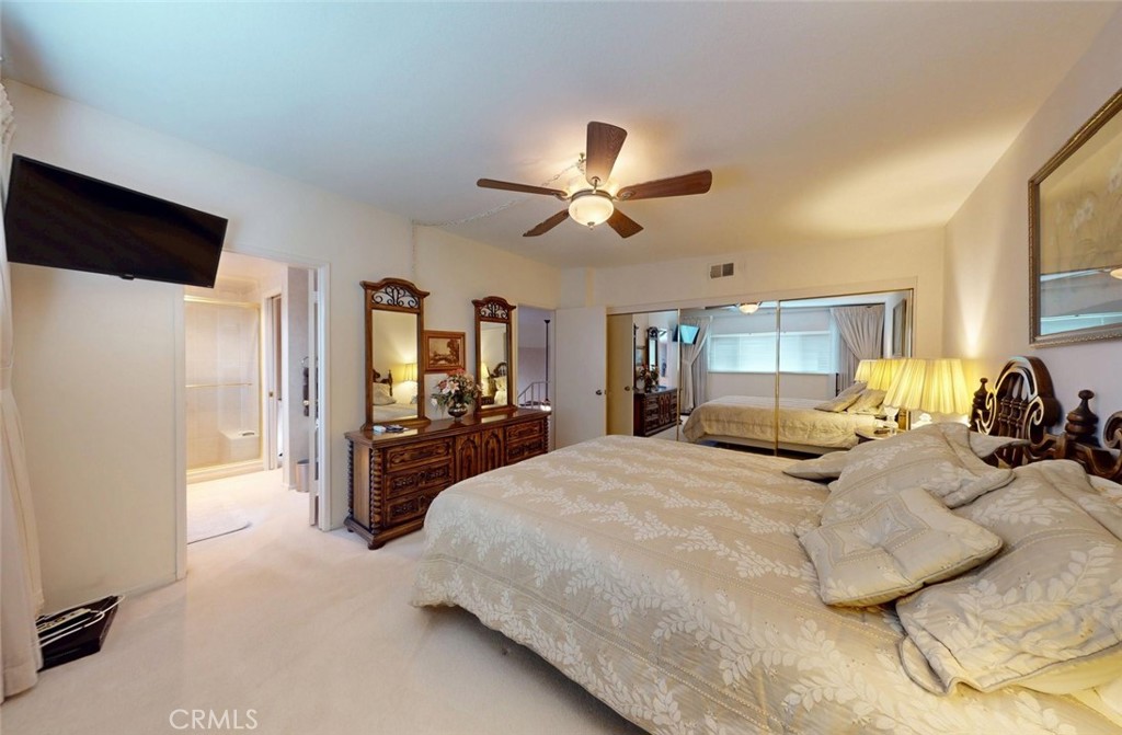 9901 Westhaven Circle Westminster, CA 92683 - Photo 28 of 41 a large bedroom with a bed a large window and furniture