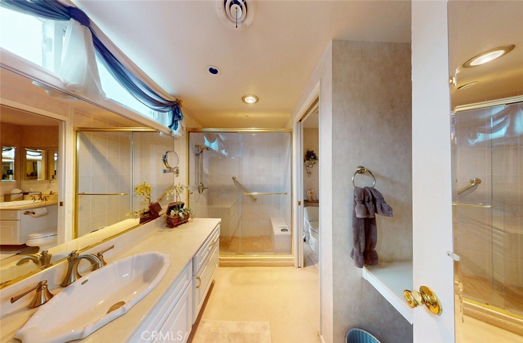 9901 Westhaven Circle Westminster, CA 92683 - Photo 29 of 41 a bathroom with a tub and a shower