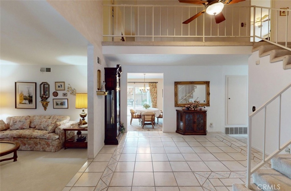 9901 Westhaven Circle Westminster, CA 92683 - Photo 3 of 41 a living room with furniture and a chandelier