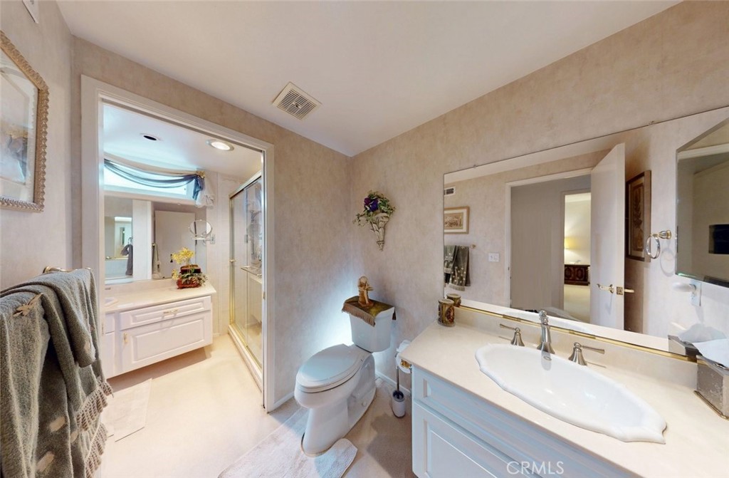 9901 Westhaven Circle Westminster, CA 92683 - Photo 32 of 41 a en suite bathroom with a granite countertop sink and a mirror