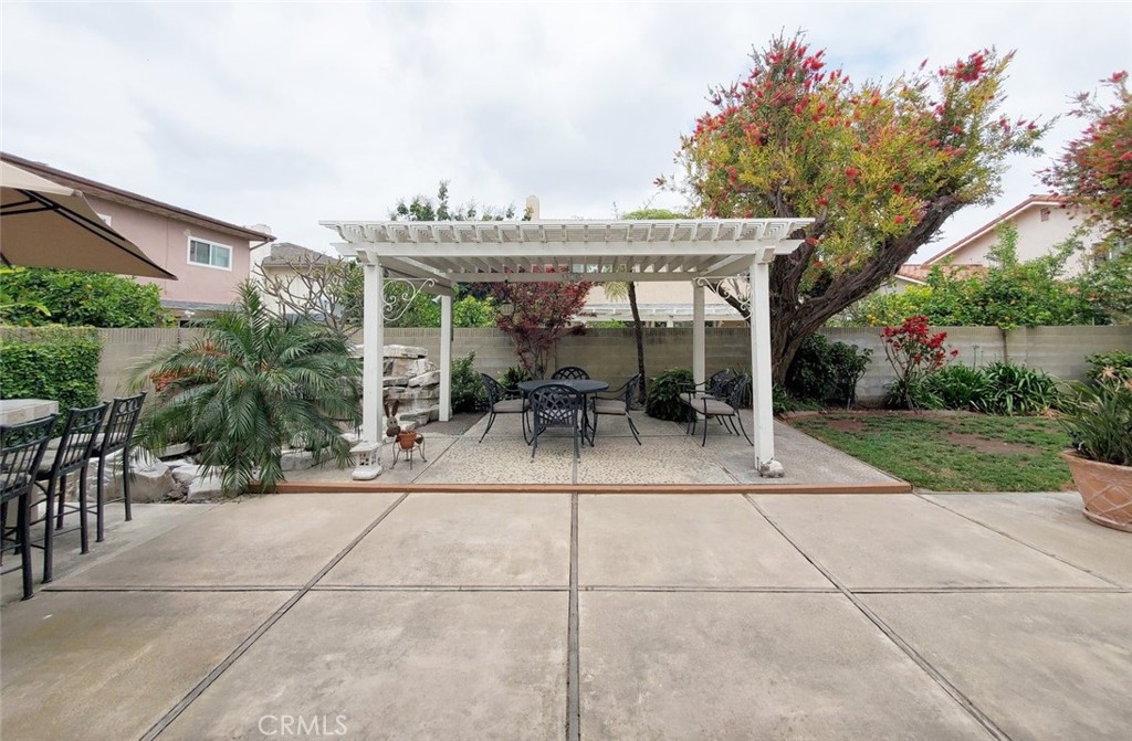9901 Westhaven Circle Westminster, CA 92683 - Photo 34 of 41 a view of a patio with a table and chairs under an umbrella