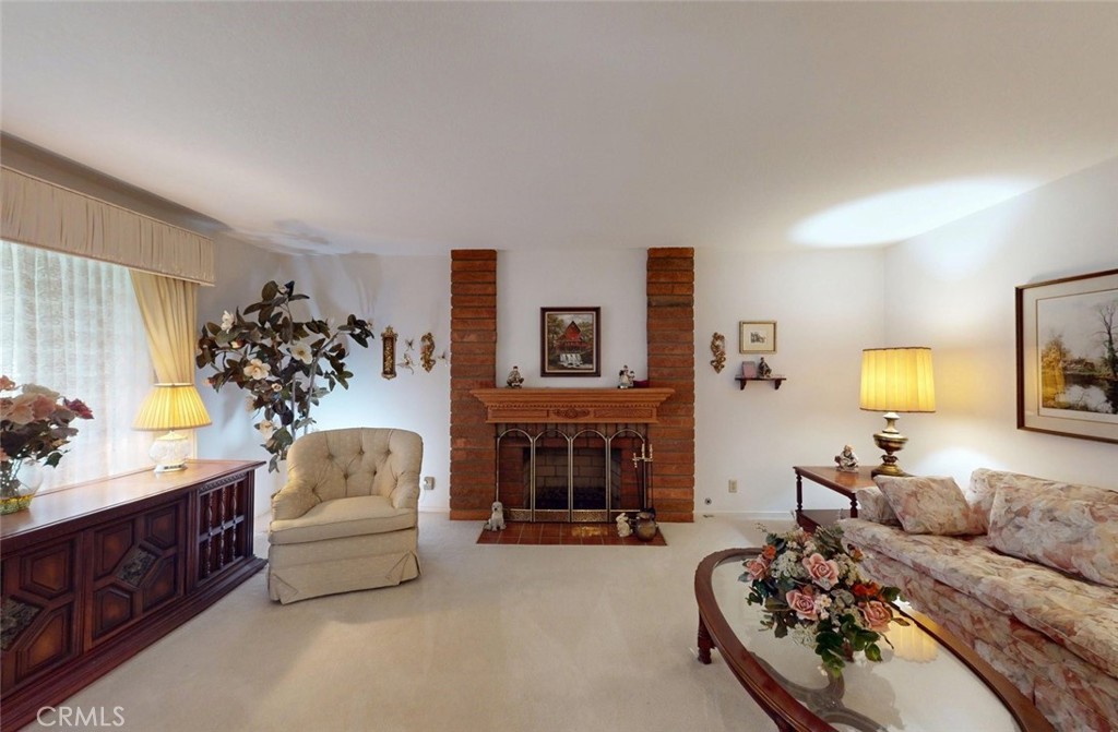 9901 Westhaven Circle Westminster, CA 92683 - Photo 4 of 41 a living room with furniture and a fireplace