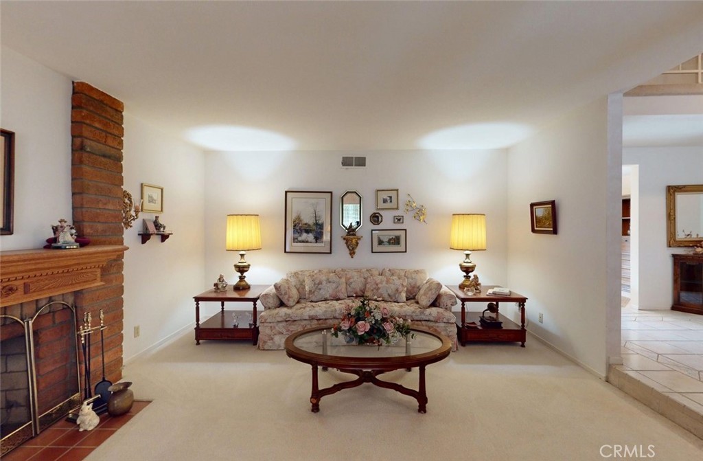 9901 Westhaven Circle Westminster, CA 92683 - Photo 5 of 41 a living room with furniture and a fireplace