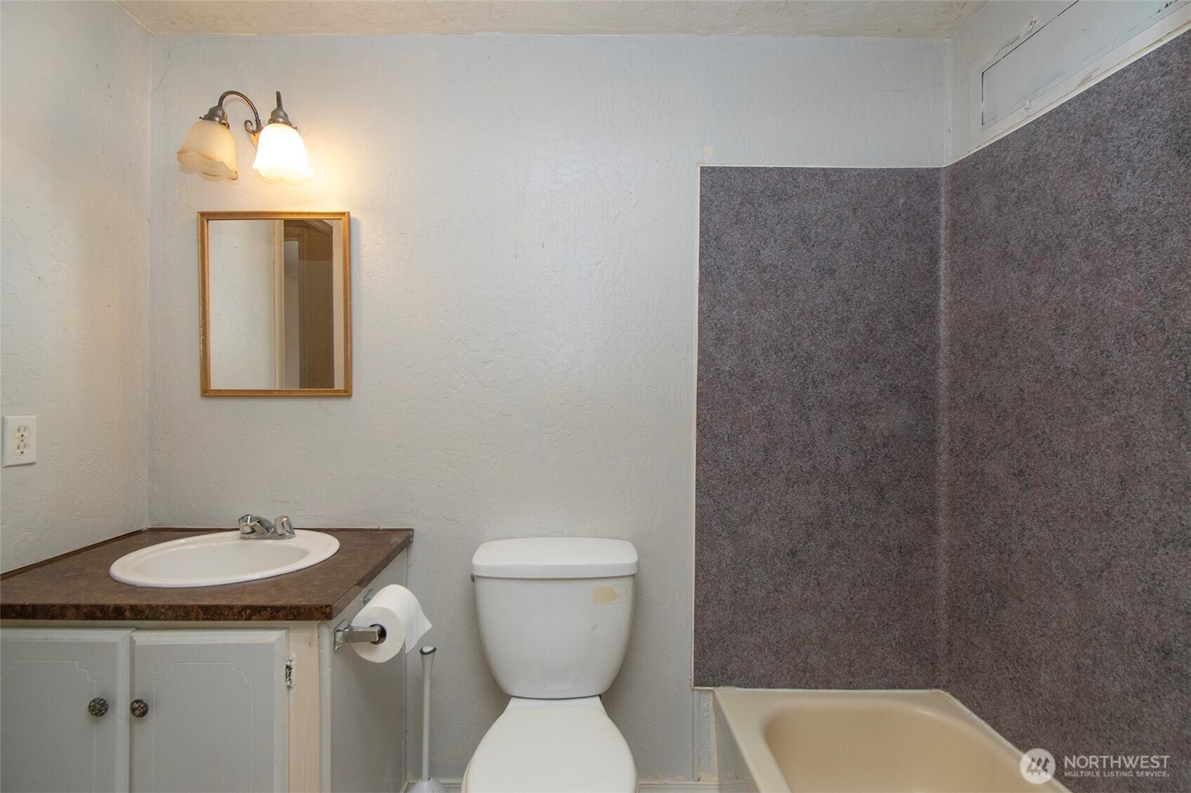 90 Baywood Village Road, Unit 34 Sequim, WA 98382 - Photo 22 of 40 a bathroom with a toilet a sink and mirror