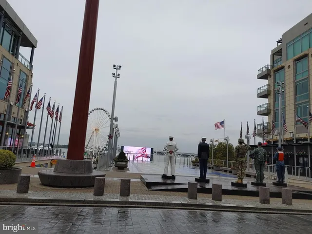 a kitchen with sink and view of living room