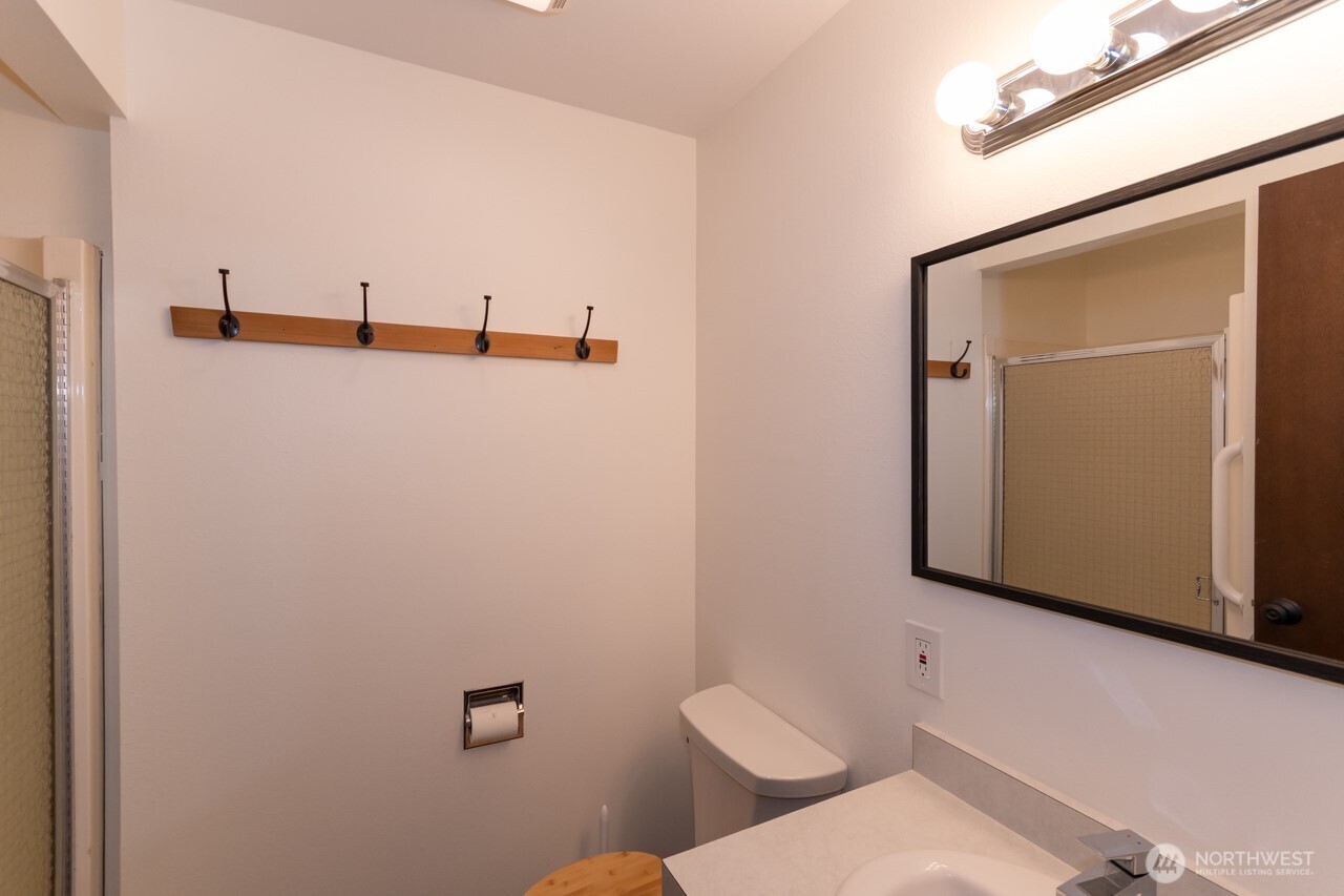 63 East Arnette Road Port Angeles, WA 98362 - Photo 28 of 40 a bathroom with a toilet and a mirror