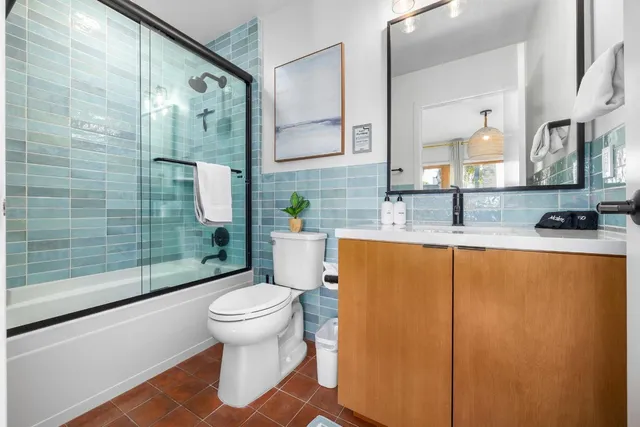 a bathroom with a shower and a toilet