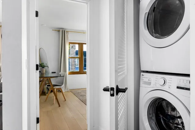 a living room with furniture and a lamp