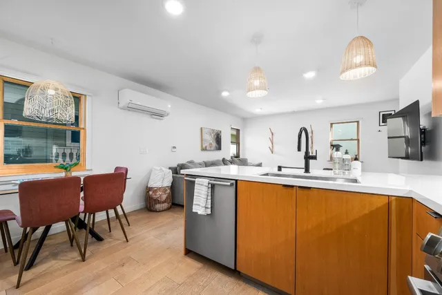 a stove top oven sitting inside of a kitchen