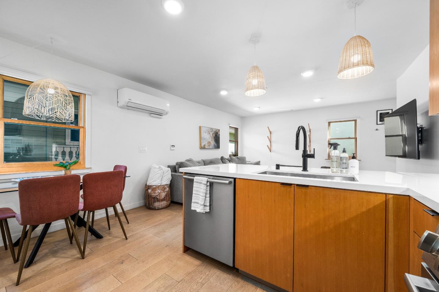 208 Capitola Avenue Capitola, CA 95010 - Photo 30 of 46 a kitchen with stainless steel appliances granite countertop a dining table chairs refrigerator and sink