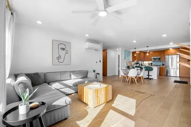 a bedroom with furniture and a window