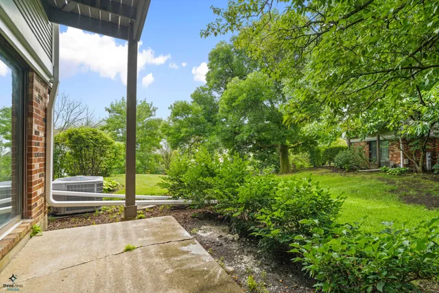 a view of backyard with green space