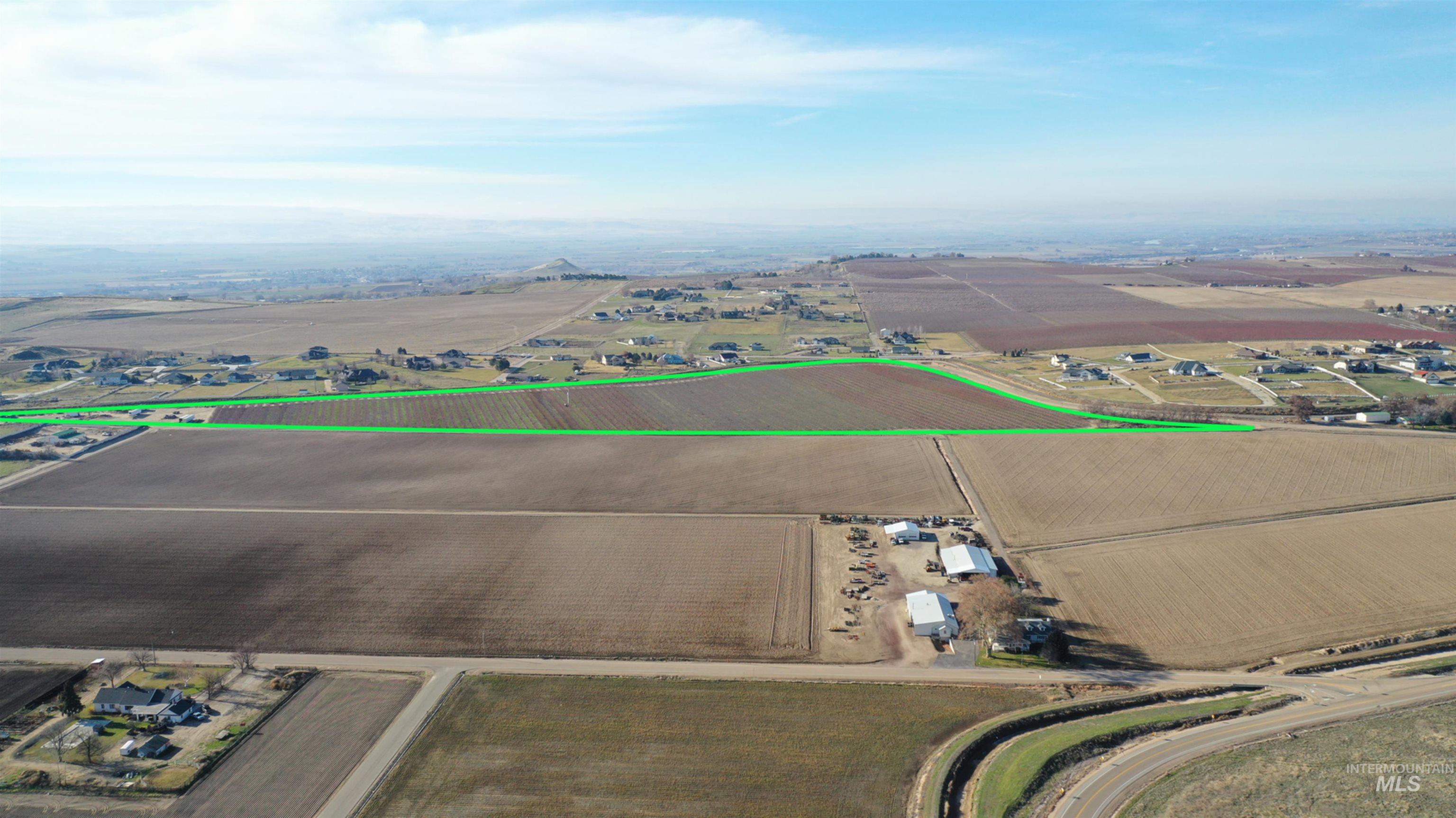Tbd Riverside Road Caldwell, ID 83607 - Photo 14 of 35 Aerial view of sparsely populated area with rows of crops and property parcel outlined