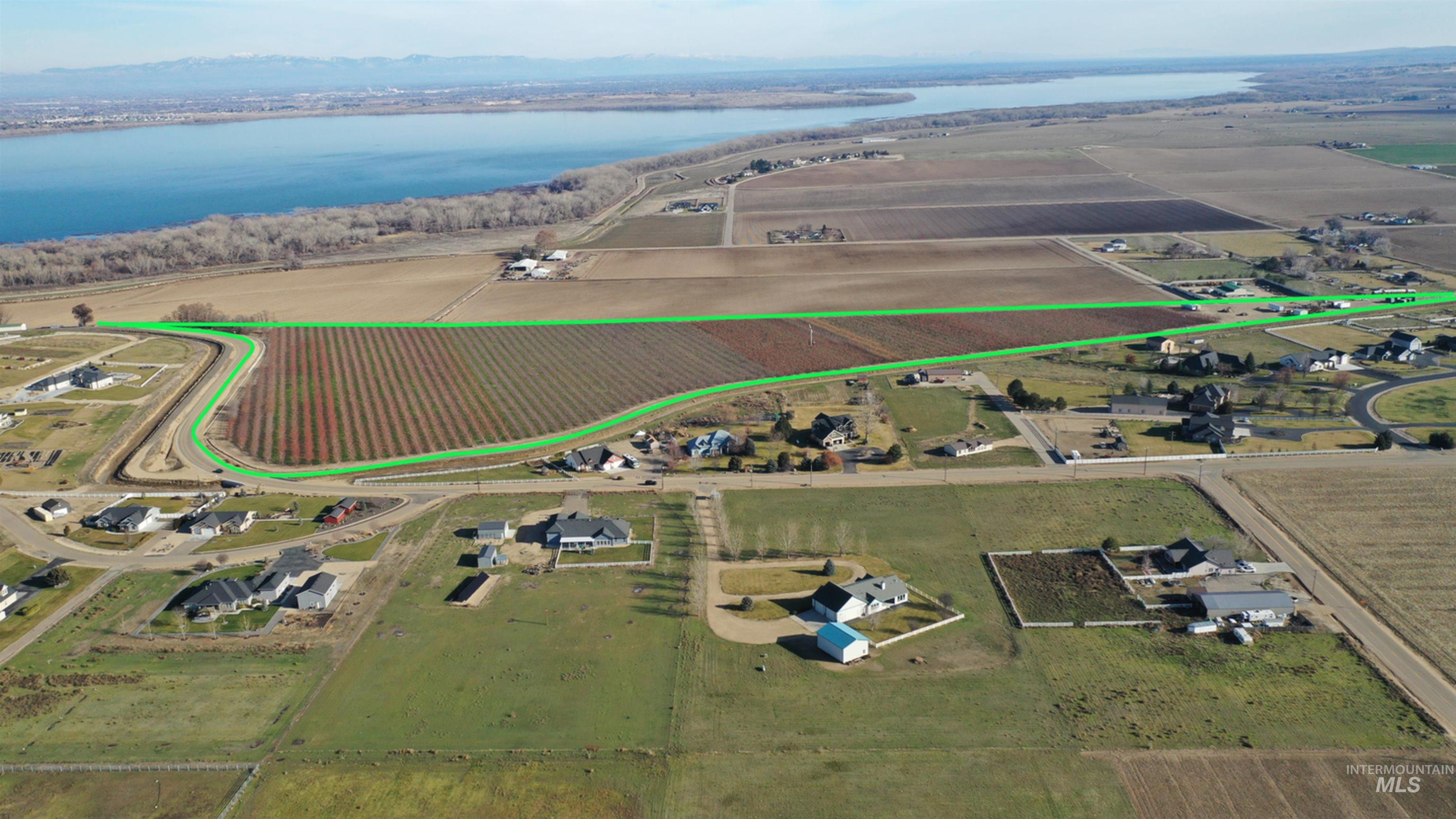 Tbd Riverside Road Caldwell, ID 83607 - Photo 6 of 35 Aerial view of sparsely populated area with large plots for crops and a large body of water