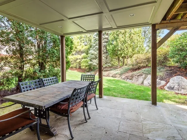 a view of a patio with a table chairs and a porch