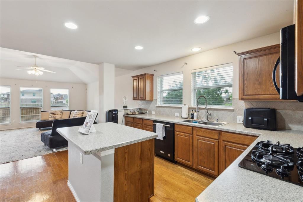 2015 Sumac Drive Forney, TX 75126 - Photo 9 of 9 a kitchen with a sink stove and cabinets