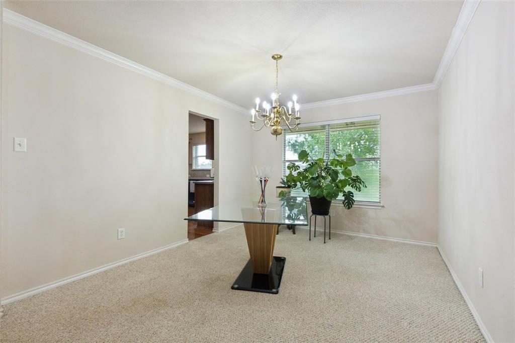 2015 Sumac Drive Forney, TX 75126 - Photo 5 of 9 a living room with furniture and a chandelier
