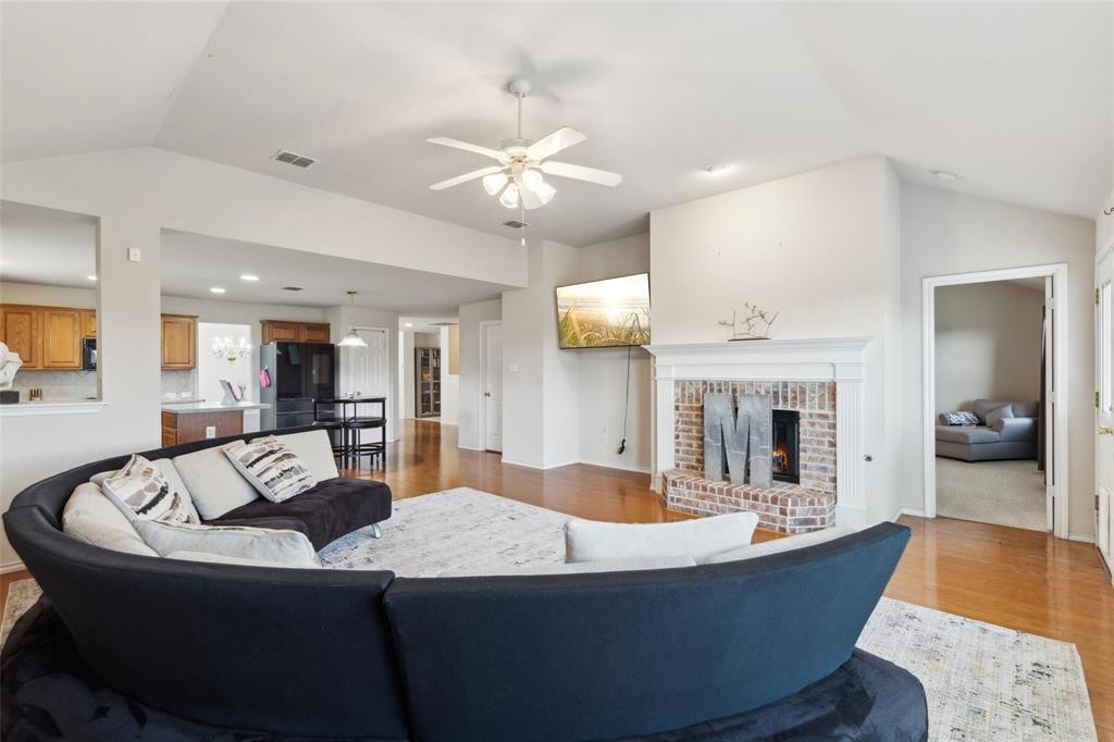 2015 Sumac Drive Forney, TX 75126 - Photo 6 of 9 a living room with fireplace furniture and a view of kitchen