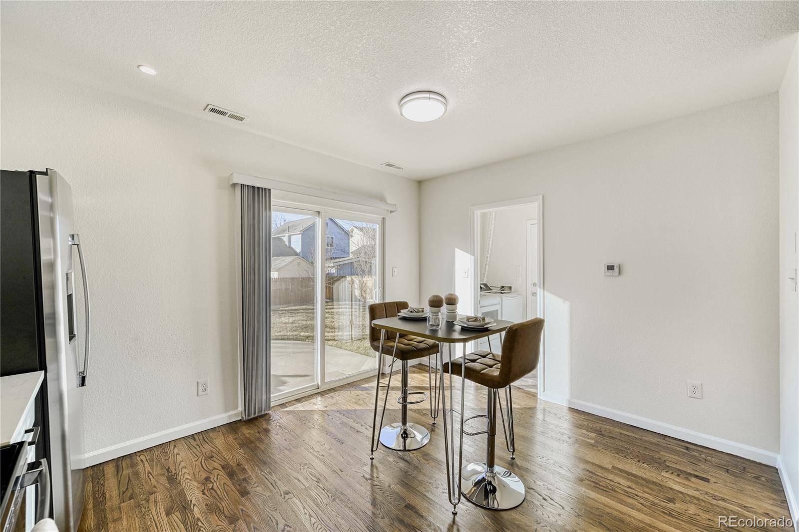 6130 Gorham Street Frederick, CO 80530 - Photo 12 of 47 a view of a livingroom with furniture and wooden floor