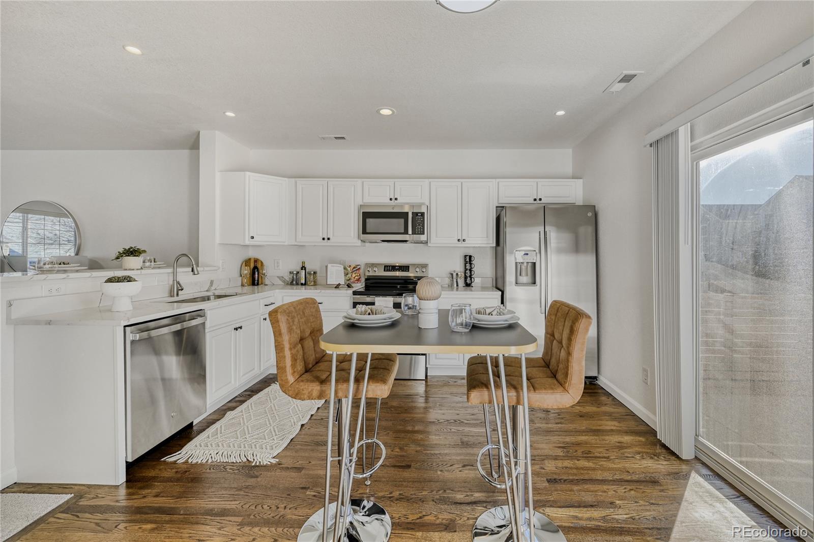 6130 Gorham Street Frederick, CO 80530 - Photo 13 of 47 a view of kitchen with cabinets and stainless steel appliances
