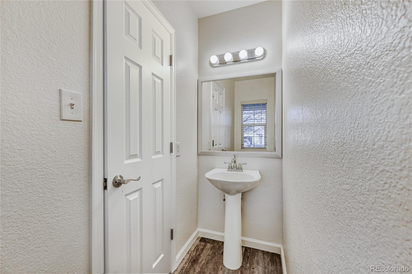 6130 Gorham Street Frederick, CO 80530 - Photo 22 of 47 a bathroom with a sink a mirror and shower