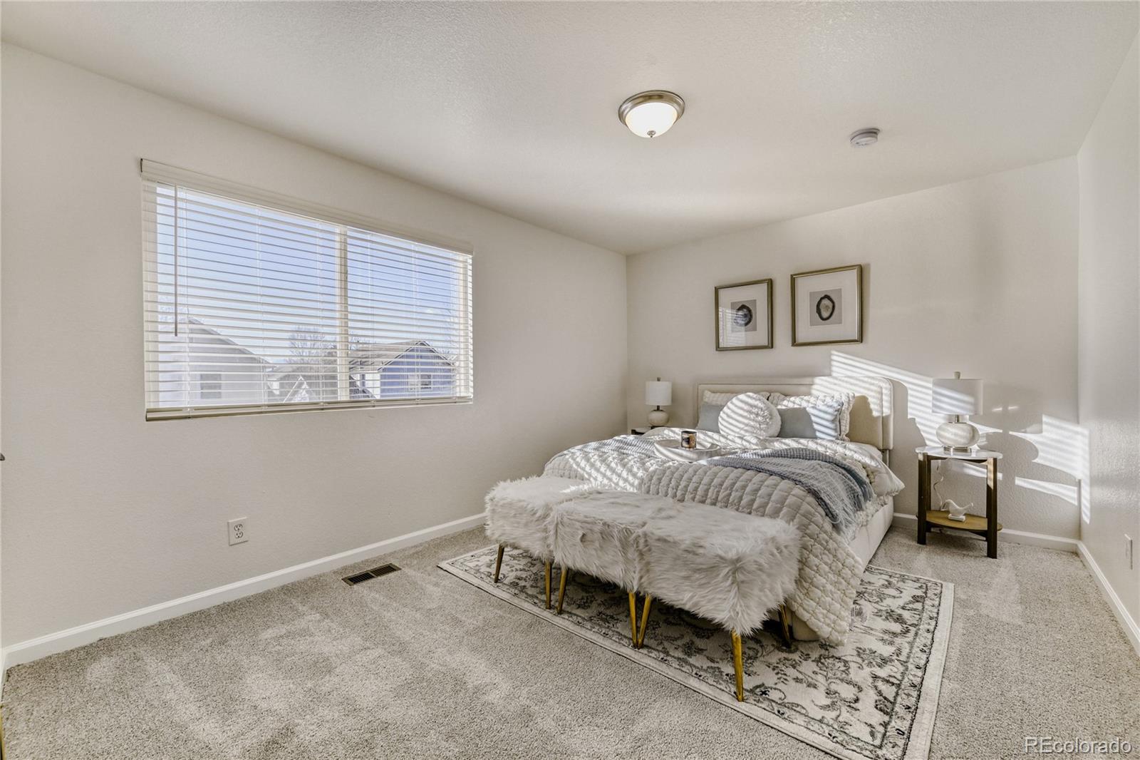 6130 Gorham Street Frederick, CO 80530 - Photo 23 of 47 a bedroom with bed and a window