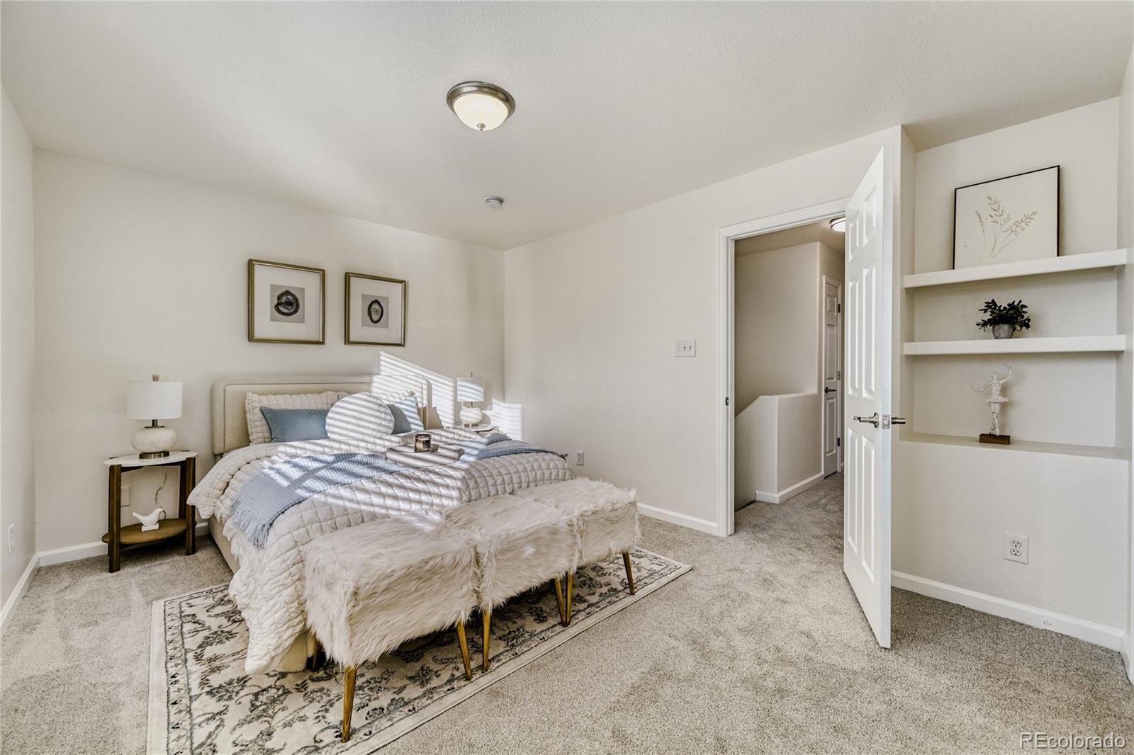 6130 Gorham Street Frederick, CO 80530 - Photo 24 of 47 a bedroom with a bed and a lamp