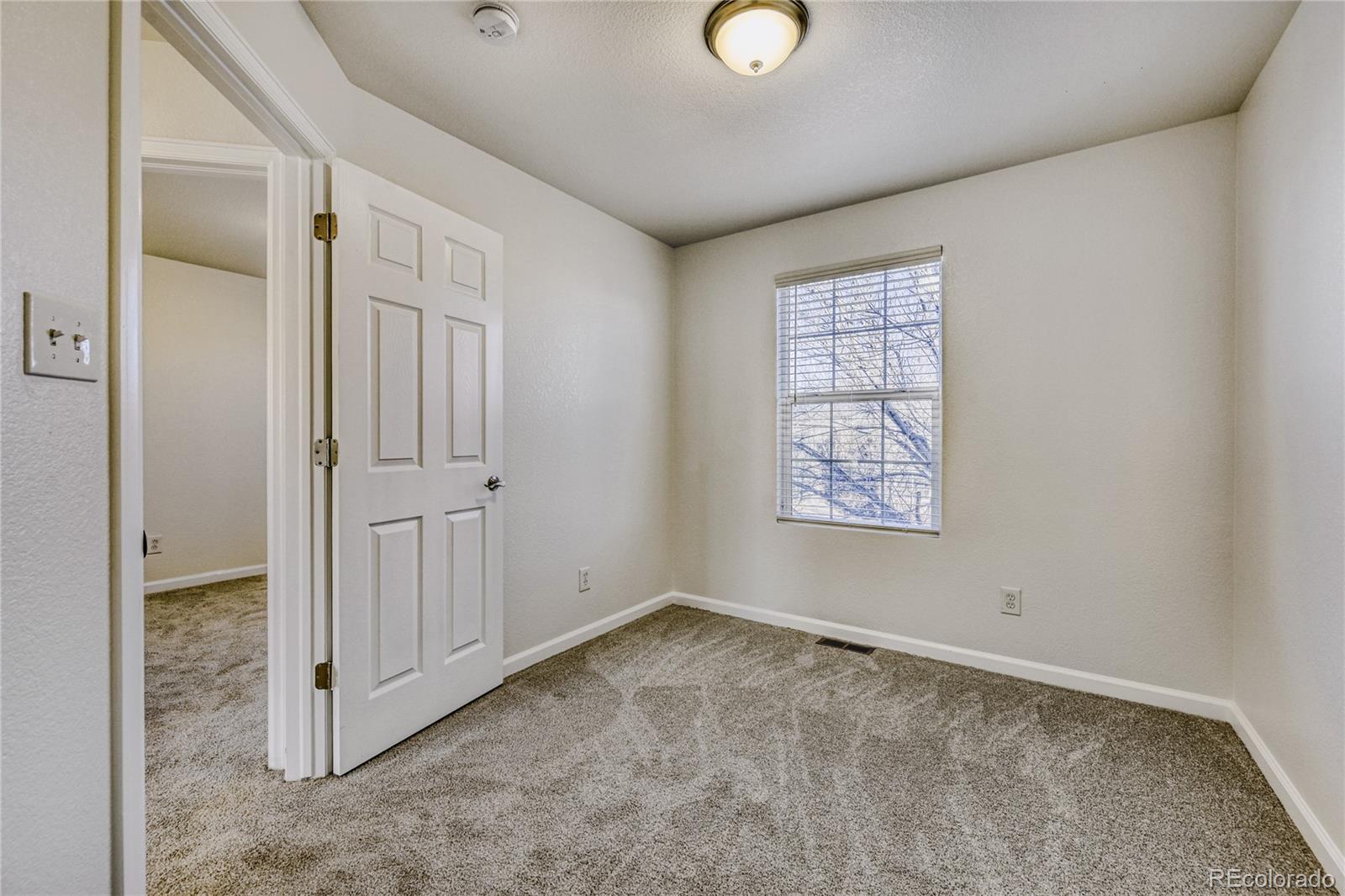 6130 Gorham Street Frederick, CO 80530 - Photo 32 of 47 an empty room with windows