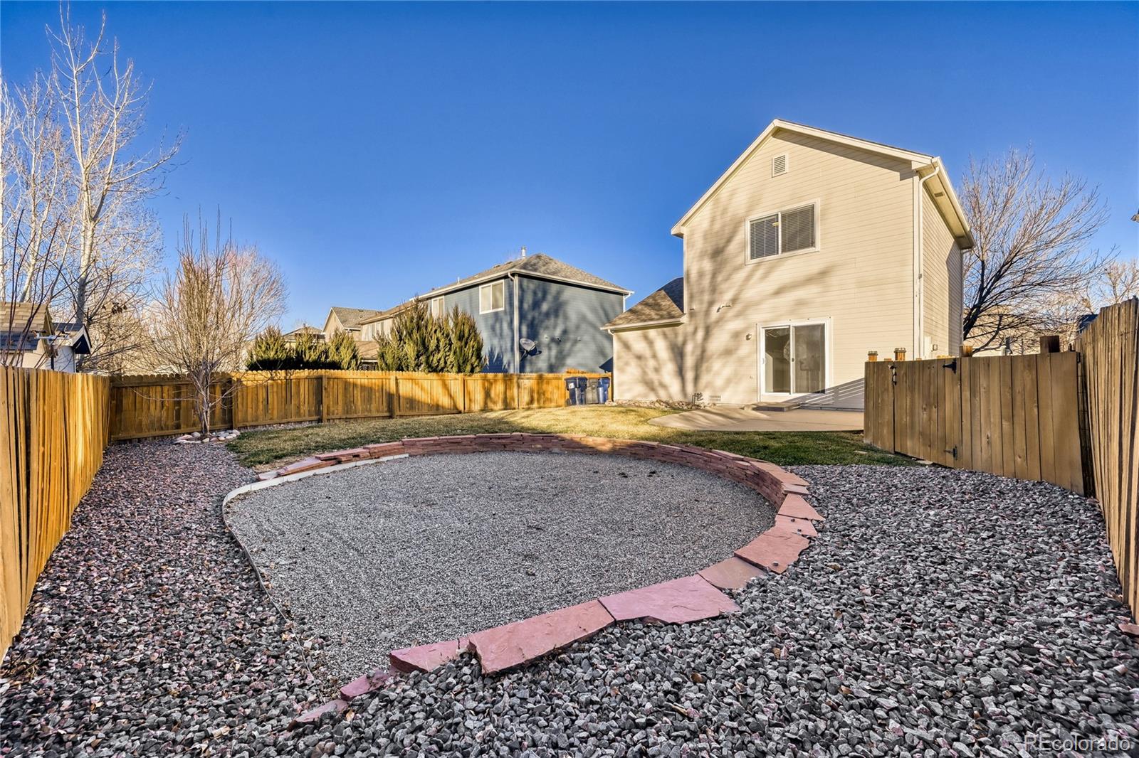 6130 Gorham Street Frederick, CO 80530 - Photo 44 of 47 a view of a house with a yard