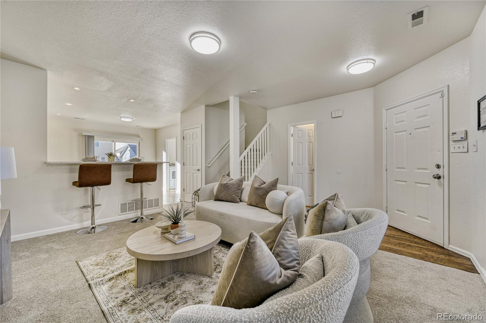 6130 Gorham Street Frederick, CO 80530 - Photo 5 of 47 a living room with furniture and a table