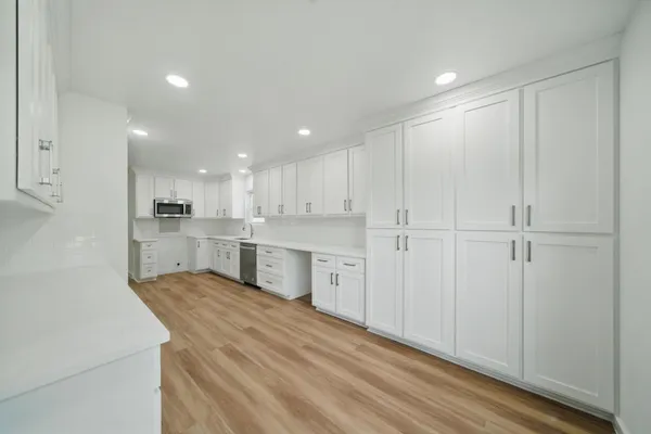 a large kitchen with cabinets