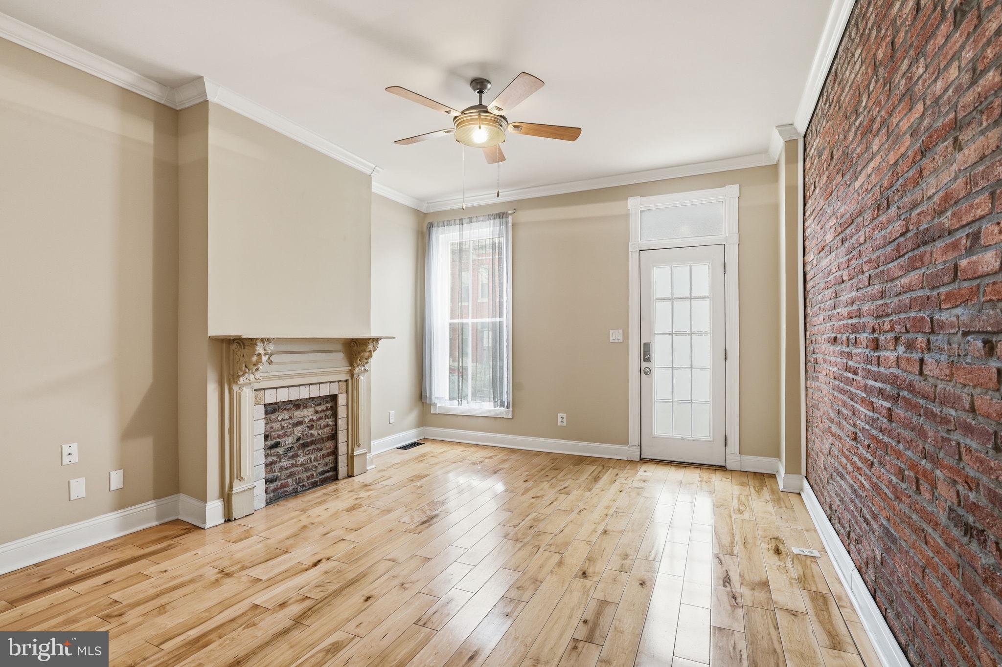 107 West Fort Avenue Baltimore, MD 21230 - Photo 2 of 34 a view of livingroom with hardwood floor and a ceiling fan