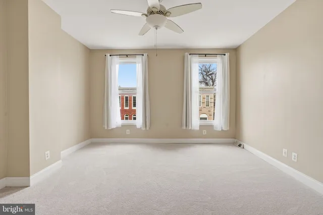 a front view of a building with many windows