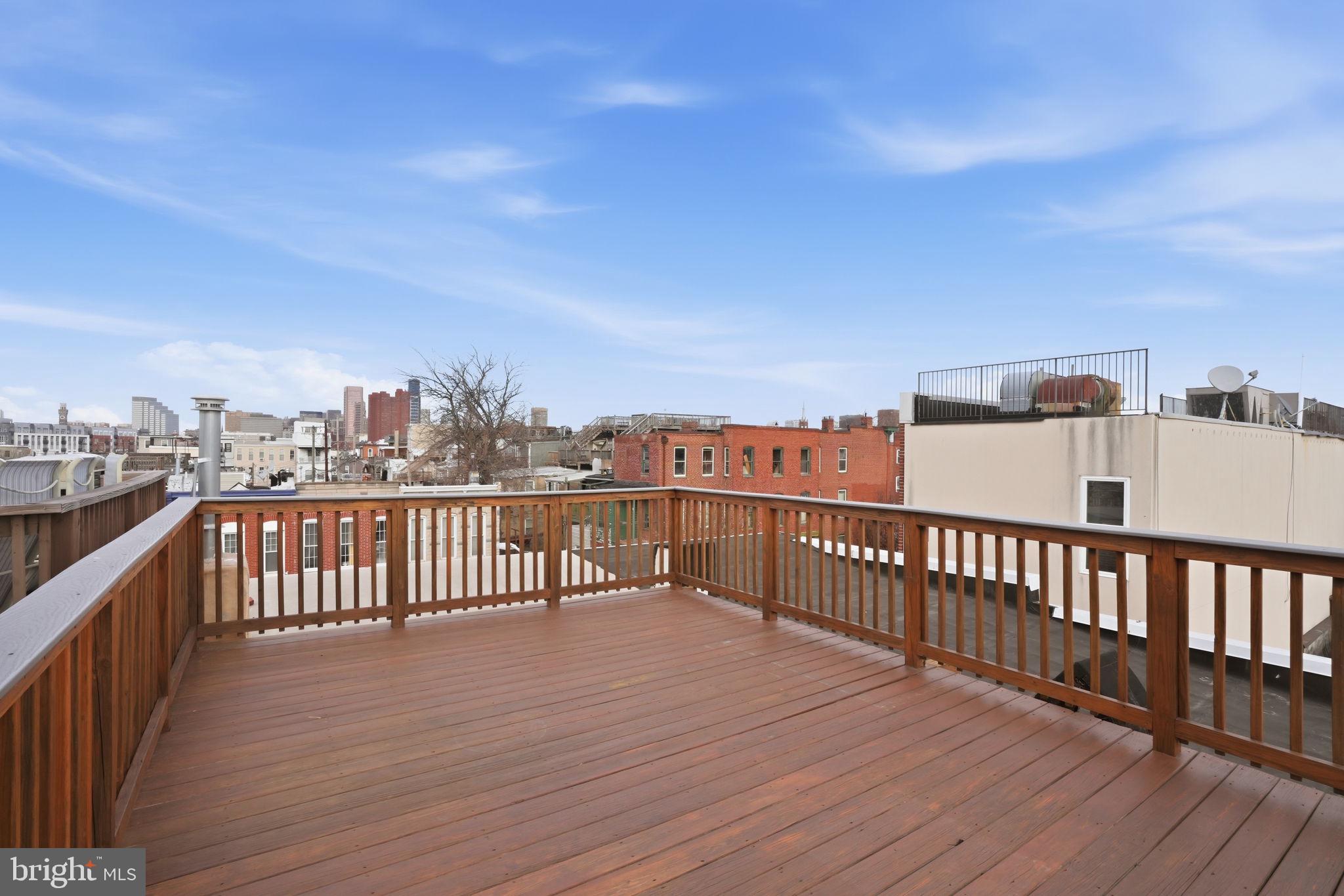 107 West Fort Avenue Baltimore, MD 21230 - Photo 27 of 34 a view of a balcony with wooden floor