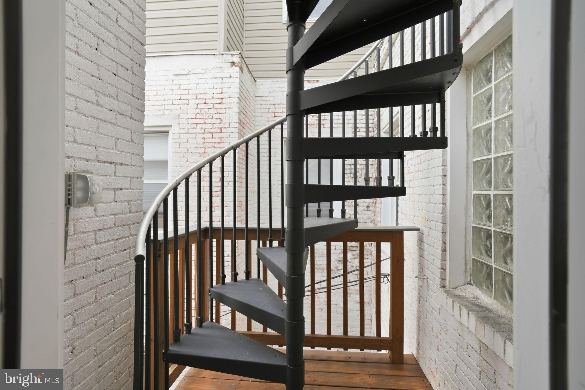 107 West Fort Avenue Baltimore, MD 21230 - Photo 30 of 34 a view of a balcony with wooden floor