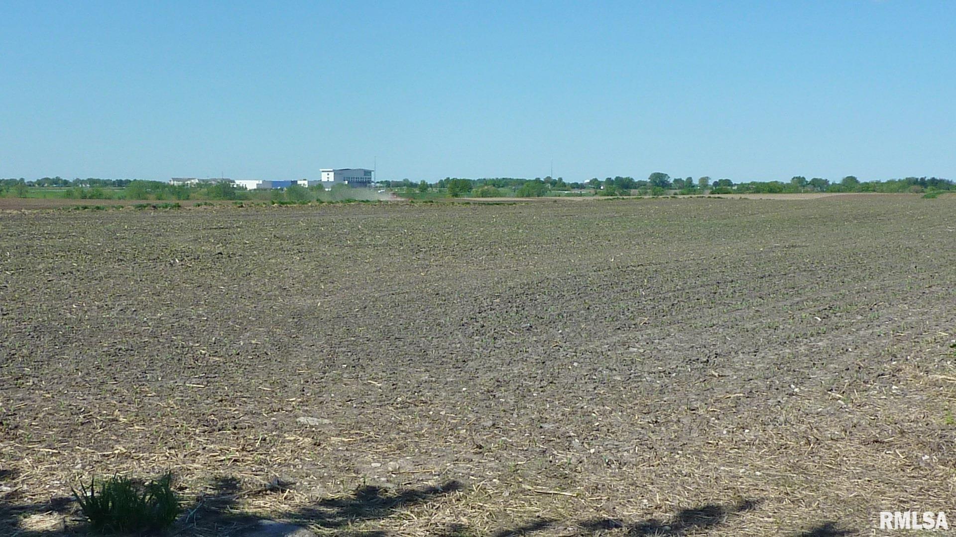 7936 Utica Ridge Road Davenport, IA 52807 - Photo 14 of 22 a view of a lake in middle of a field