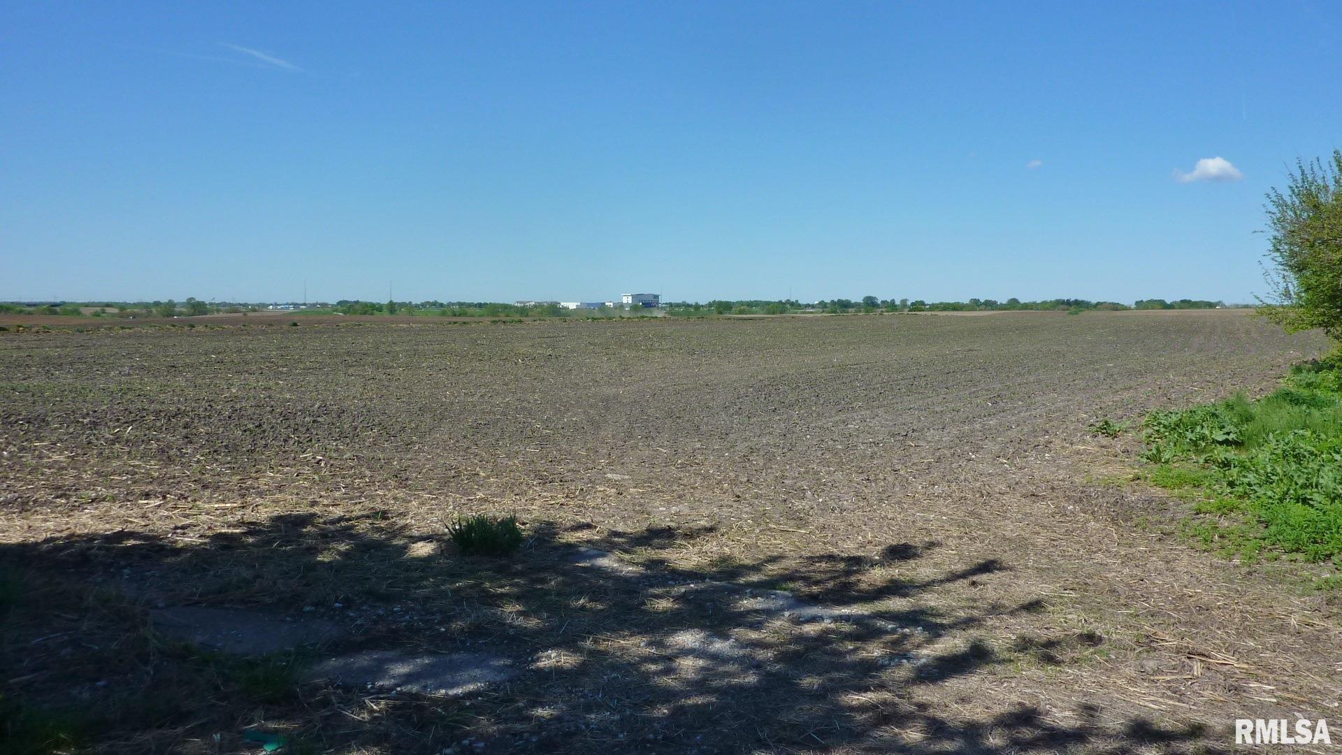 7936 Utica Ridge Road Davenport, IA 52807 - Photo 15 of 22 a view of a lake with a mountain